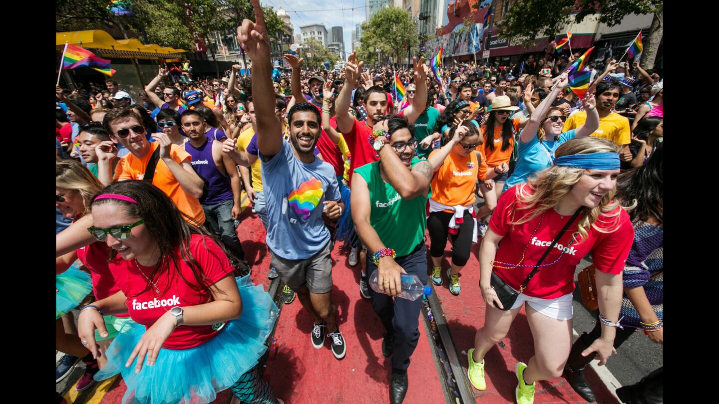 Employees of Facebook march down Market Street for the 45th Annual San Francisco Pride Parade on Sunday, two days after the Supreme Court ruled that same-sex couples have a constitutional right to marriage that can't be denied by state law.