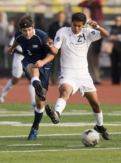 Corona del Mar's Brian Ford battles for a ball with Paramount's Juan Ortega during a CIF Southern Section Division III semifinal game at Paramount High.
