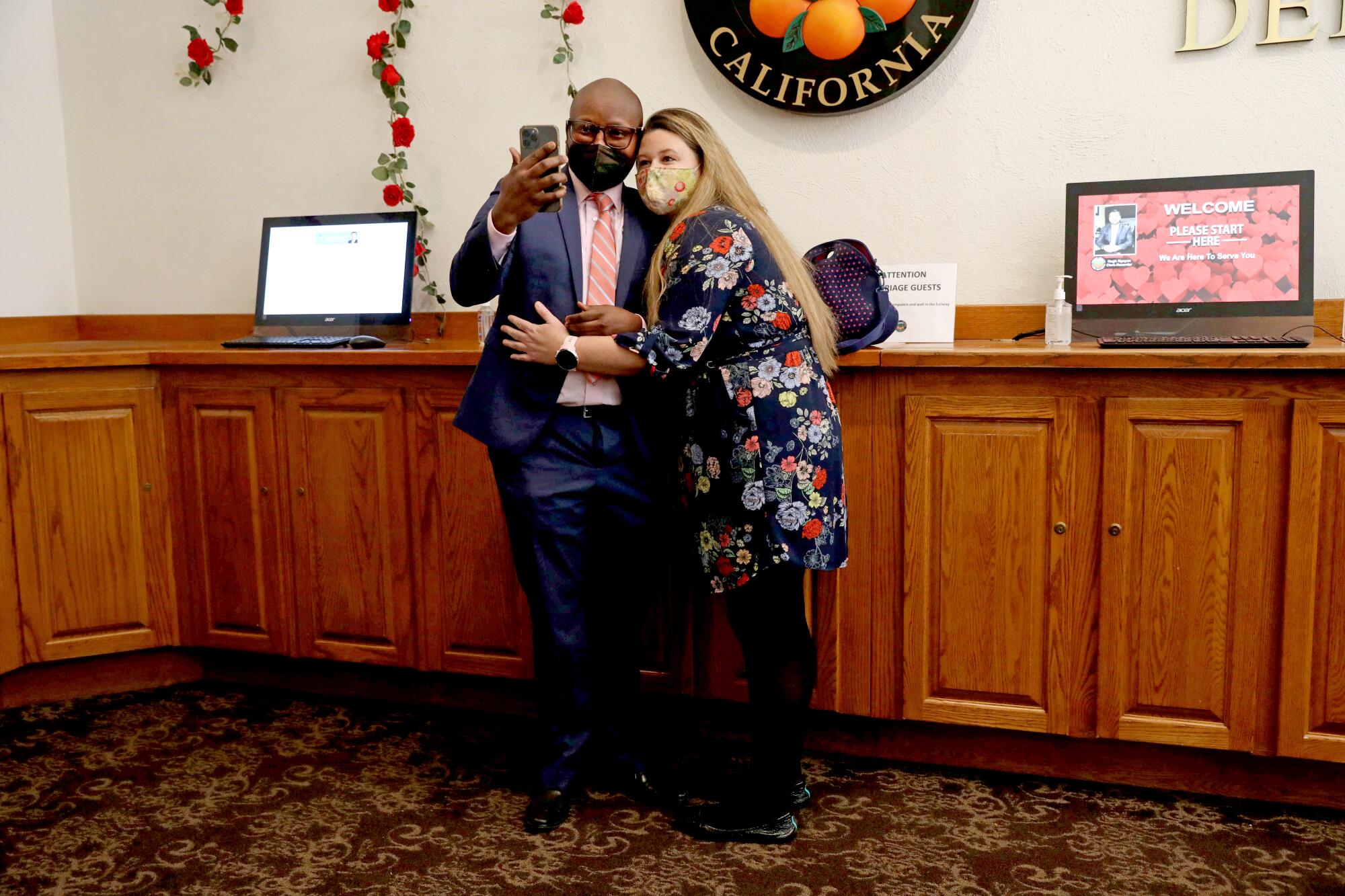 A couple takes a selfie after registering to marry at the courthouse.