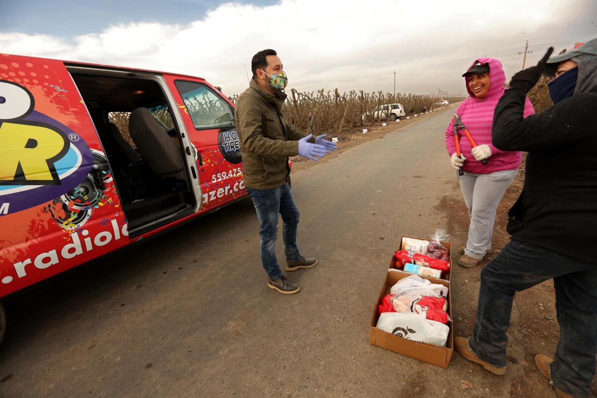 Ricardo Castorena enjoys a spirited conversation with farmworkers