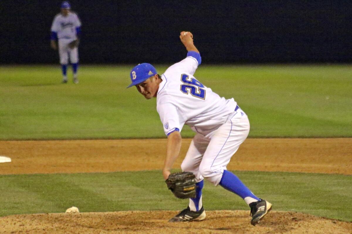 UCLA reliever David Berg delivers a pitch in the ninth inning of a 1-0 Bruins win over Long Beach State on Feb. 24.