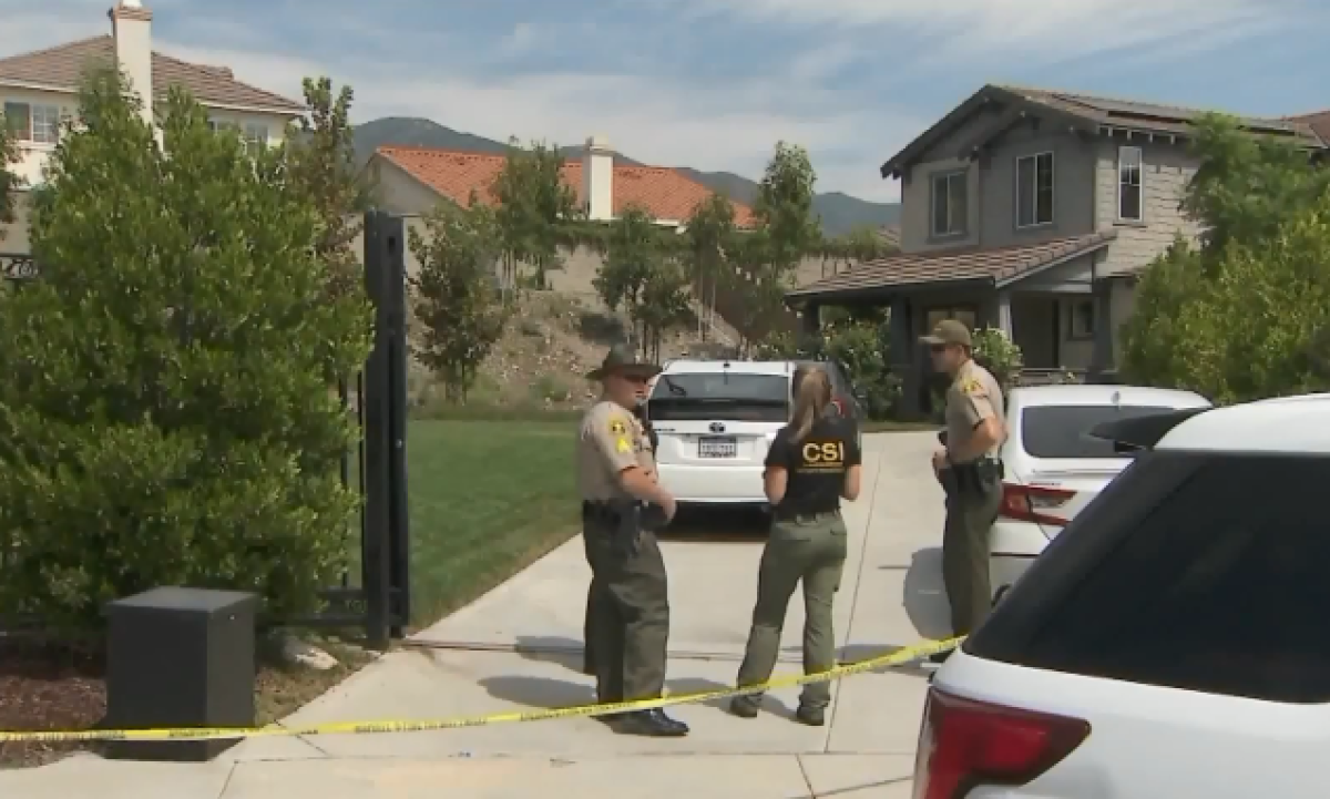 Deputies gather at the scene of a fatal stabbing in Rancho Cucamonga on Monday.