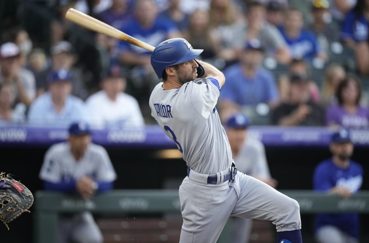 The Dodgers' Chris Taylor follows through on a three-run homer during the first inning July 16, 2021.