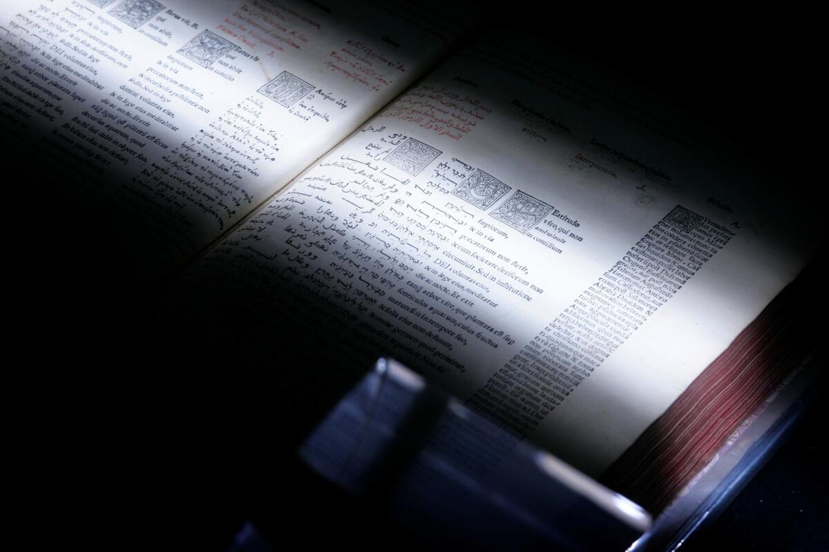 A scanner passes over a book in 2008 at the University of Michigan, where one of hundreds of librarians from all over the world was helping Google Inc.'s Book Search create digital versions of millions of titles.