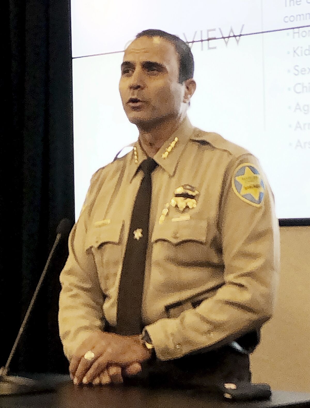 Maricopa County Sheriff Paul Penzone is shown at an Aug. 12, 2020, news conference at his office in Phoenix. A court-appointed official has criticized Penzone's efforts to reduce a backlog of 1,800 internal affairs case against his officers and complained the sheriff hasn't heeded his team's suggestions for chipping away at the backlog. (AP Photo/Jacques Billeaud)