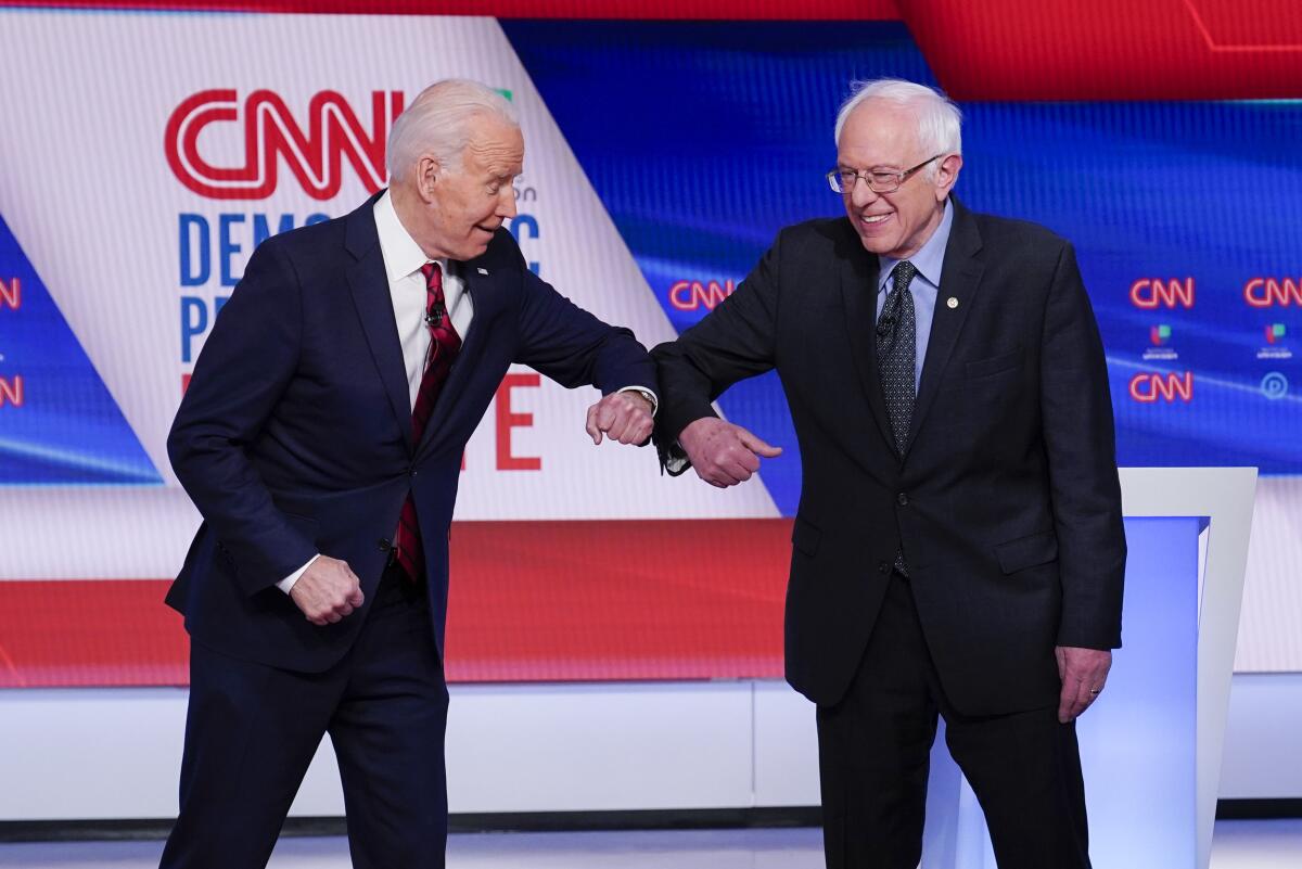 Joe Biden and Bernie Sanders at the final Democratic primary debate in March