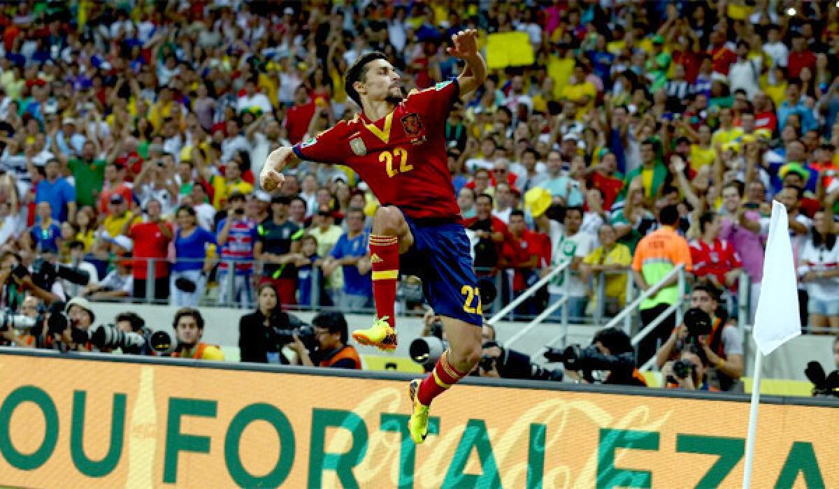 Jesus Navas celebrates scoring the winning penalty in a shootout during the FIFA Confederations Cup Brazil 2013 semifinal match between Spain and Italy.