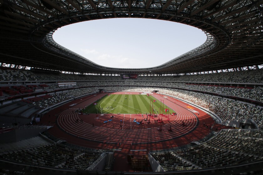 FILE - In this May 9, 2021, file photo, a general view of National Stadium during an athletics test event for the Tokyo 2020 Olympics Games in Tokyo. IOC officials say the Tokyo Olympics will open on July 23 and almost nothing now can stop the games from going forward. (AP Photo/Shuji Kajiyama, File)