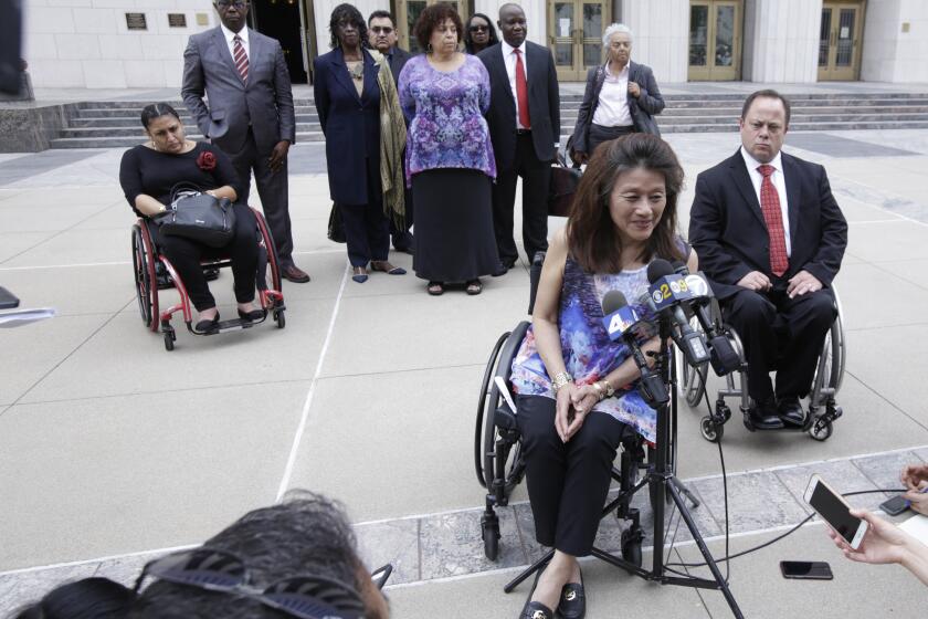 LOS ANGELES CA. JUNE 7, 2017: Whistleblower Mei Ling speaks, with her attorney Scott Moore behind her, during a media availability on June 7, 2017, outside the U.S. Courthouse in Los Angeles. The U.S. Intervened in the â€˜Whistleblowerâ€™ Lawsuit against City of Los Angeles that Alleges City Received Millions of Dollars in Federal Grants and knowingly failed to Provide Housing Accessible to the Disabled. (Glenn Koenig/ Los Angeles Times)