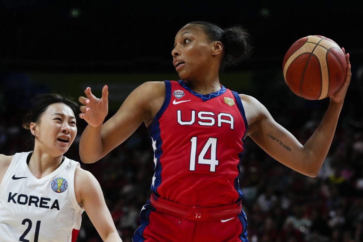 United States' Betnijah Laney looks to pass the ball as South Korea's Kim Jinyeong watches during their game at the women's Basketball World Cup in Sydney, Australia, Monday, Sept. 26, 2022. (AP Photo/Mark Baker)