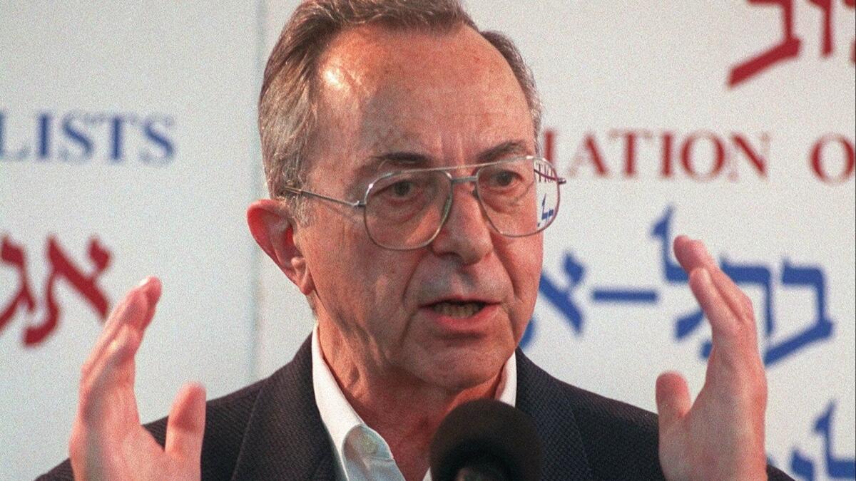 Moshe Arens speaks at a press conference in 1999 when he announced his candidacy for prime minister.