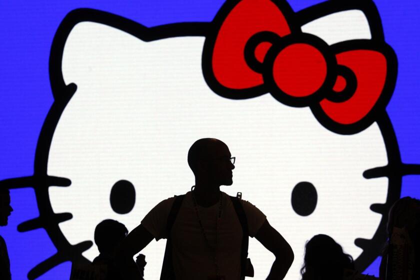 LOS ANGELES, CA - OCTOBER 30, 2014 -- Michael Coleman, from San Francisco, center, visits the first day of the Hello Kitty Con 2014 at The Geffen Contemporary at MOCA in Los Angeles on October 30, 2014. The event will go through November 2. (Genaro Molina/Los Angeles Times)
