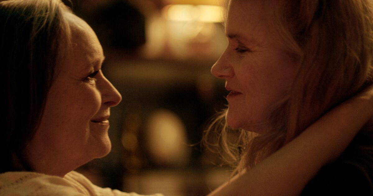 Martine Chevallier and Barbara Sukowa smile at each other in "Two of Us."