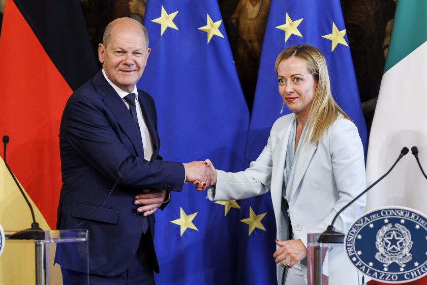 Prime Minister Giorgia Meloni shakes hands with the Chancellor of the Federal Republic of Germany Olaf Scholz in Rome Thursday, June 8, 2023.(Roberto Monaldo/LaPresse via AP)