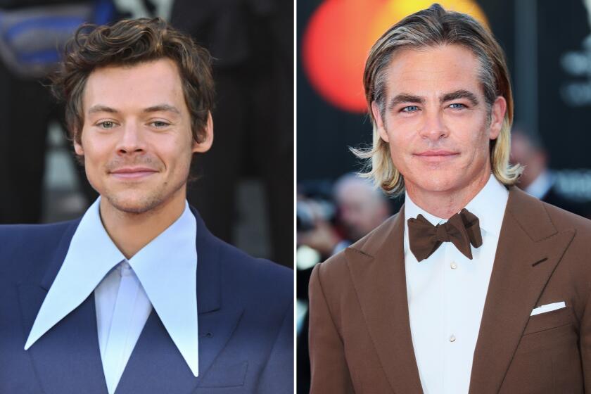 Harry Styles, left, and Chris Pine attend the "Don't Worry Darling" red carpet at the 79th Venice International Film Festival on September 05, 2022 in Venice, Italy.