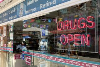 A drug store in Playa del Carmen advertises a range of medications.