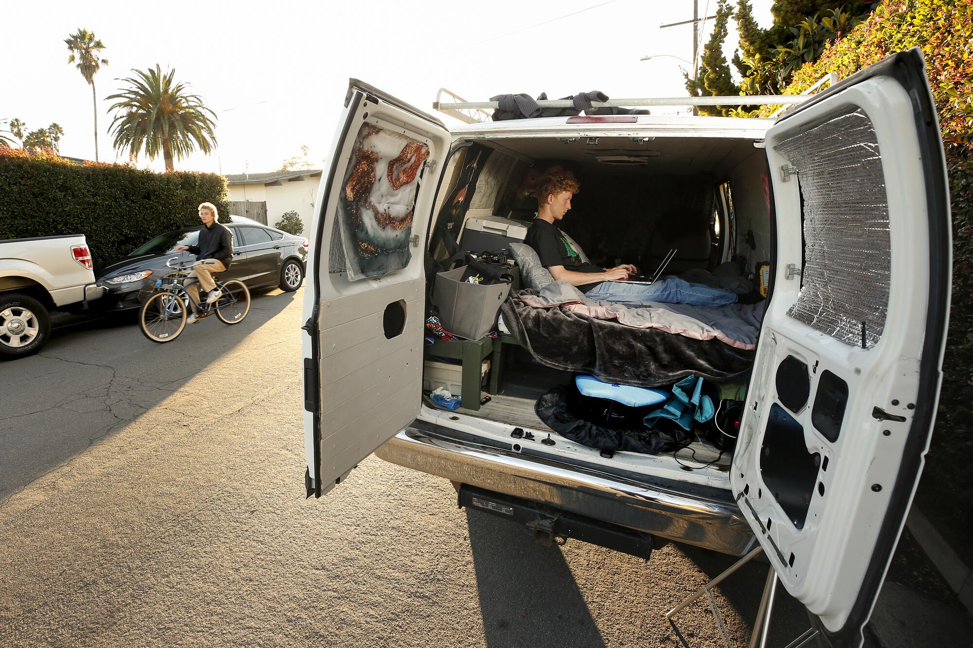 UCSB student Kris Hotchkiss sits in a van borrowed from a close friend. 