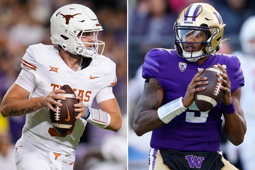 Texas quarterback Quinn Ewers, left, and Washington quarterback Michael Penix Jr.