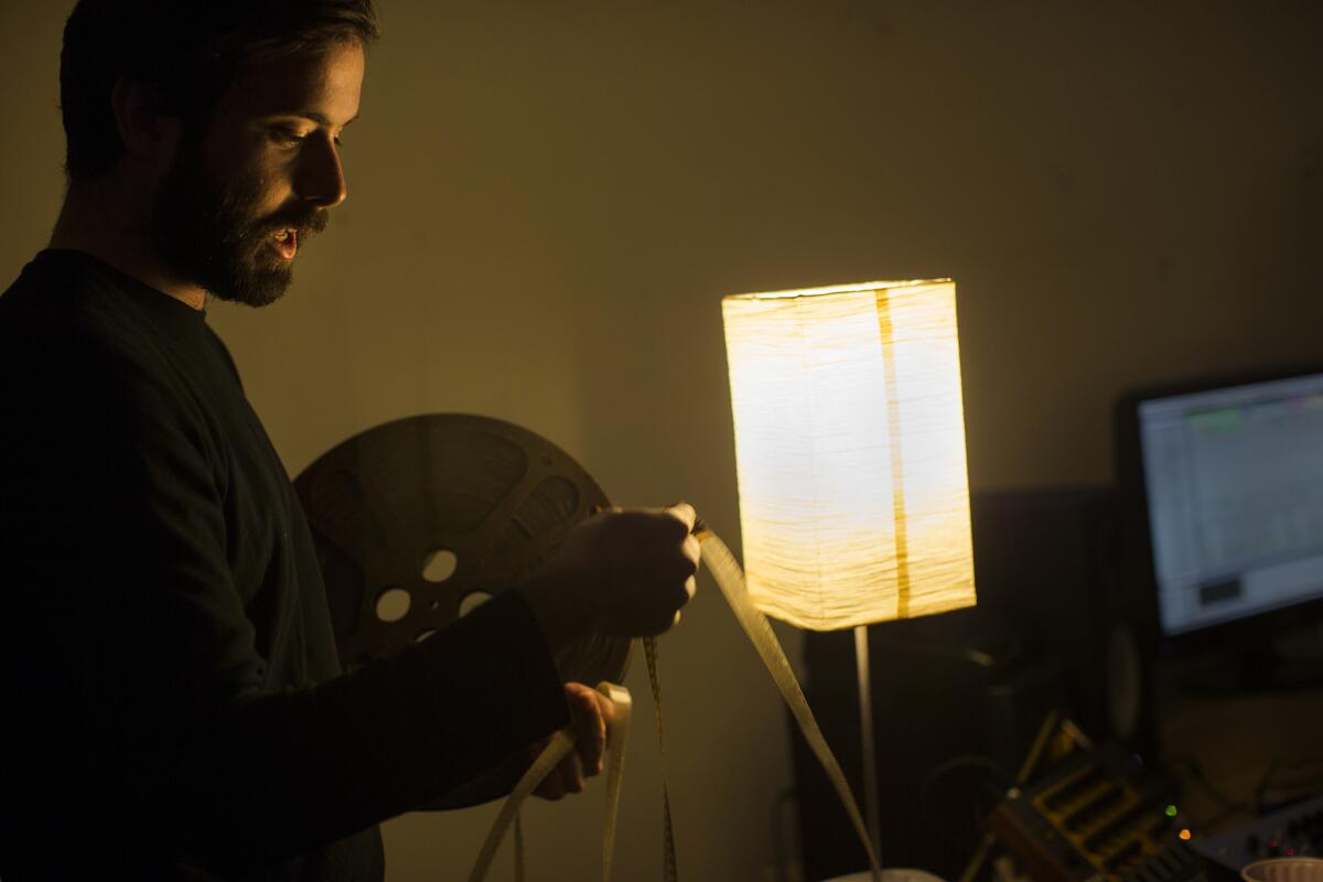 Electronic producer Lawrence Grey works in his sound studio to produce unique music using old analog tapes, starch and sunlight. For his new video, he worked with found 16-millimeter film footage.