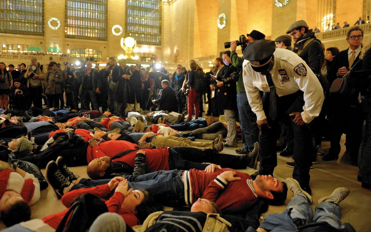 People participate in a "die-in" protest on Wednesday against the decision of a grand jury not to indict a police officer involved in the death of Eric Garner.