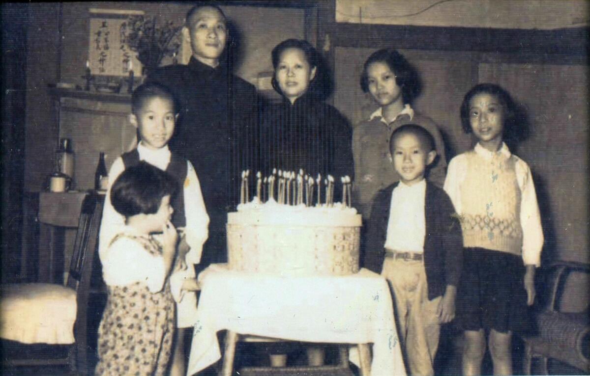 A 1953 photo of the Chang family in Taiwan. shows Cindy Chang's father, Bei-dwo (Northern Bell), second from left, and her grandfather, Xuan-yao, third from left. The names were based on lines of a poem.