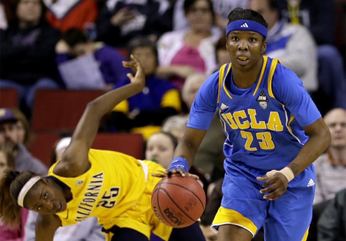 UCLA's Markel Walker (23) heads upcourt as California's Gennifer Brandon regains her footing.