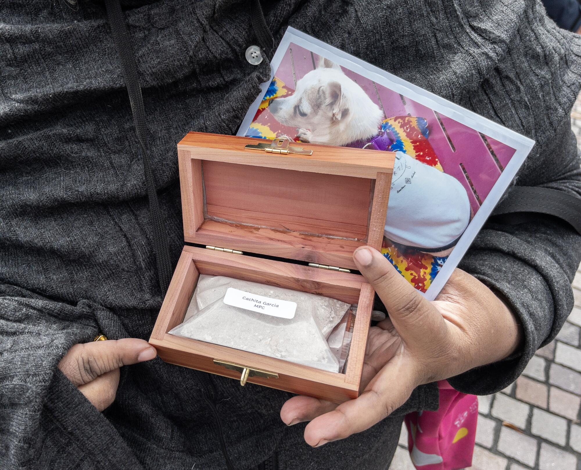 Cecilia Garcia brought the ashes of her dog Cachita to be blessed.