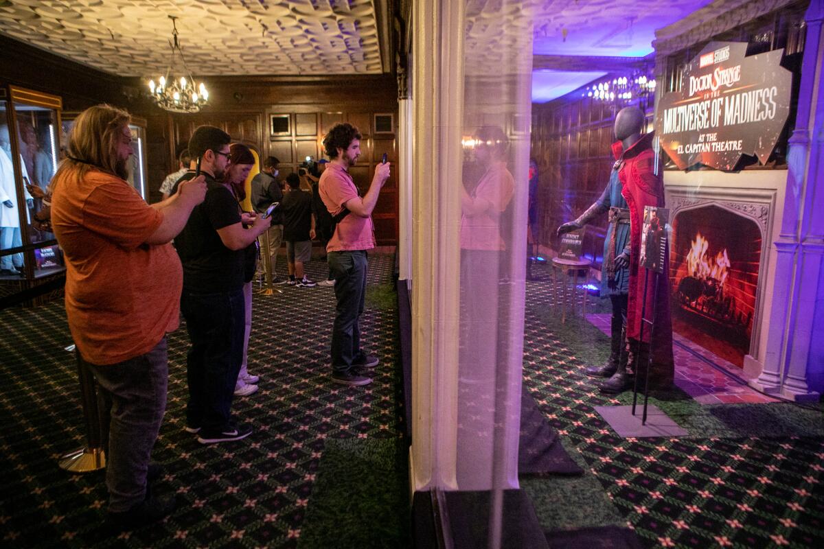 Fans tour an exhibit of costumes from the film before the first screening.