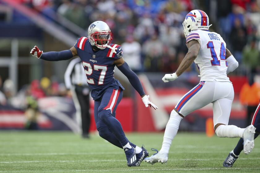 New England Patriots cornerback J.C. Jackson (27) defends Buffalo Bills wide receiver Stefon Diggs (14) during the second half of an NFL football game, Sunday, Dec. 26, 2021, in Foxborough, Mass. (AP Photo/Stew Milne)