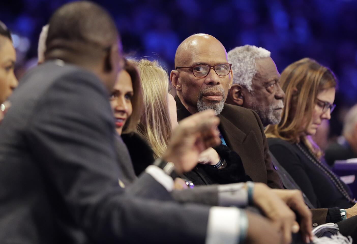 Hall of Famers Kareem Abdul-Jabbar, center, speaks with Dominique Wilkins, left, as they attend NBA All-Star Saturday Night along with Bill Russell.