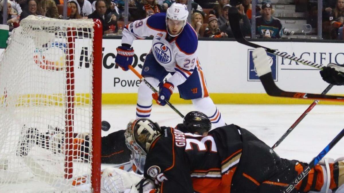 Oilers forward Leon Draisaitl scores on Ducks goaltender John Gibson during the second period of a game at Honda Center on Jan. 25.