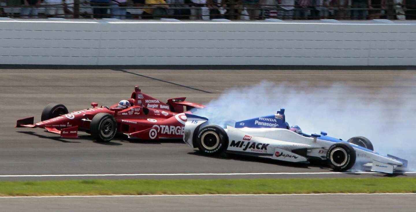 Takuma Sato's car spins in the first turn after he tried to pass leader Dario Franchitti on the final lap of the 96th Indianapolis 500 on Sunday. Franchitti would go on to win under caution.