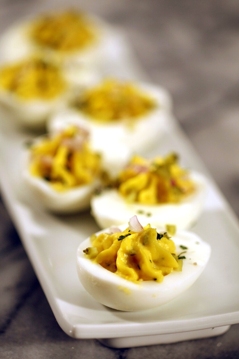 Deviled eggs with tarrragon and cornichons. Recipe:Deviled eggs with tarragon and cornichons