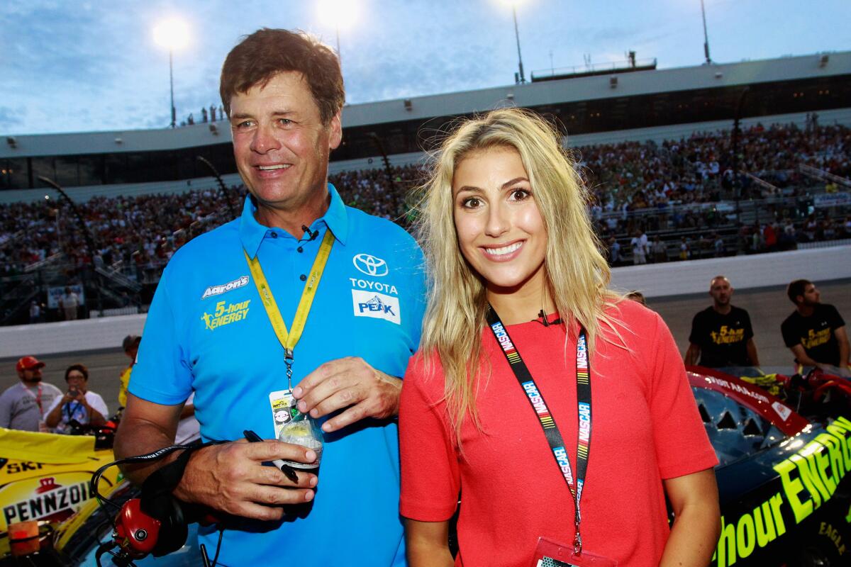 Michael Waltrip takes part in pre-race ceremonies with his "Dancing with the Stars" partner Emma Slater at Richmond International Raceway on Sept. 6.
