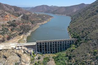 May 26, 2021, San Diego, California_USA_| View of the Lake Hodges Dam in this view looking east from the southwest end of the lake. At upper left is Del Dios Highway. |_Photo Credit: Photo by Charlie Neuman