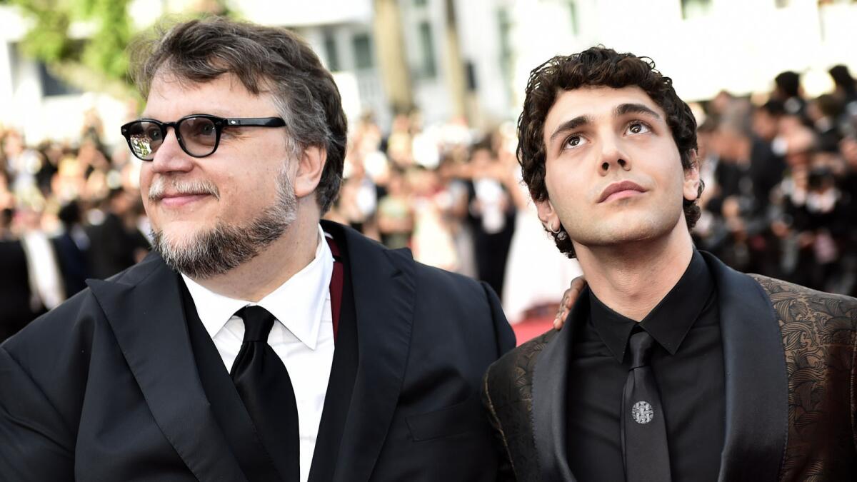 Feature Film jury members Guillermo del Toro, left, and Canadian director Xavier Dolan pose for photographers at the Cannes Film Festival.