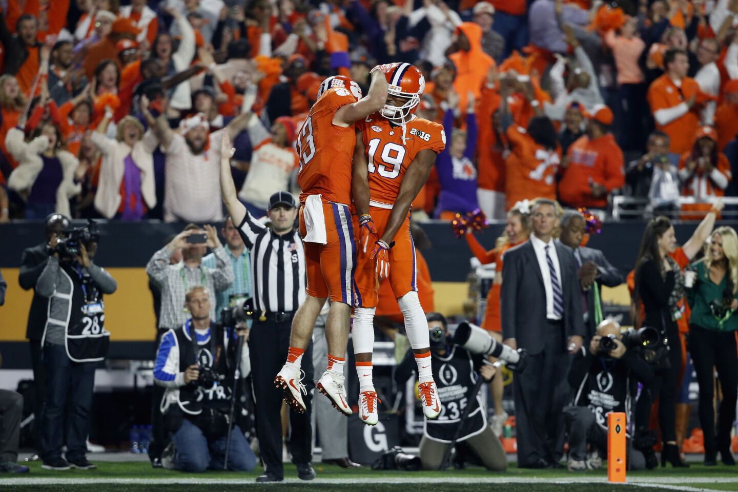 Clemson receiver Hunter Renfrow celebrates with his teammate Charone Peake after scoring a 31-yard touchdown pass in the first quarter.