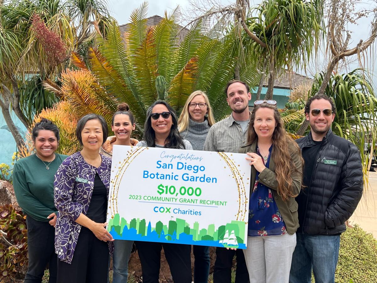 Members of the San Diego Botanic Garden team with Cox Charities grant check.