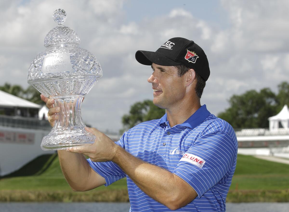 Padraig Harrington poses with the trophy after winning the Honda Classic golf tournament in Palm Beach Gardens, Fla.