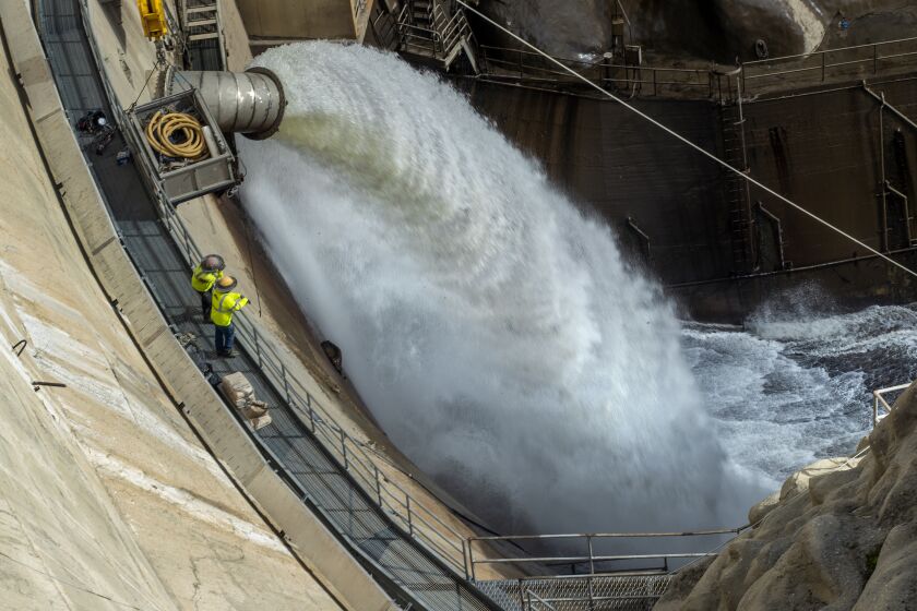 ARCADIA, CA-JANUARY 20, 2023:Water is released at 15 cubic feet per second from the Santa Anita Dam. 600,000 cubic yards of muck more than 80 feet deep have collected in the reservoir behind the 96 year old dam. Because of this, the water is unable to be impounded there and is instead being allowed to flow out and conveyed through the flood control infrastructure to spreading grounds further away. (Mel Melcon / Los Angeles Times)