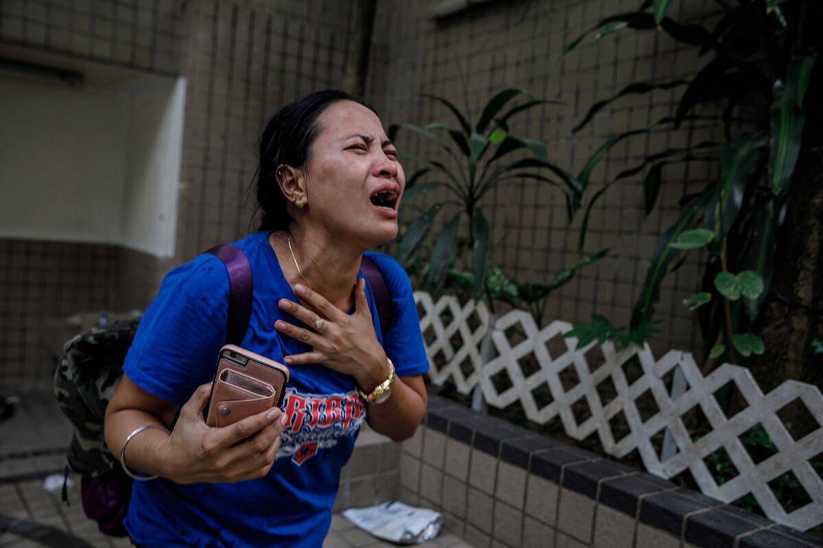 A worker trapped in a Hong Kong park is stricken with tear gas.