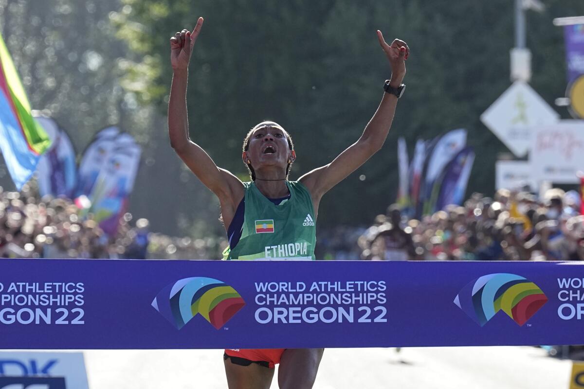 Gotytom Gebreslase, of Ethiopia, wins the women's marathon at the World Athletics Championships Monday, July 18, 2022, in Eugene, Ore. (AP Photo/Gregory Bull)
