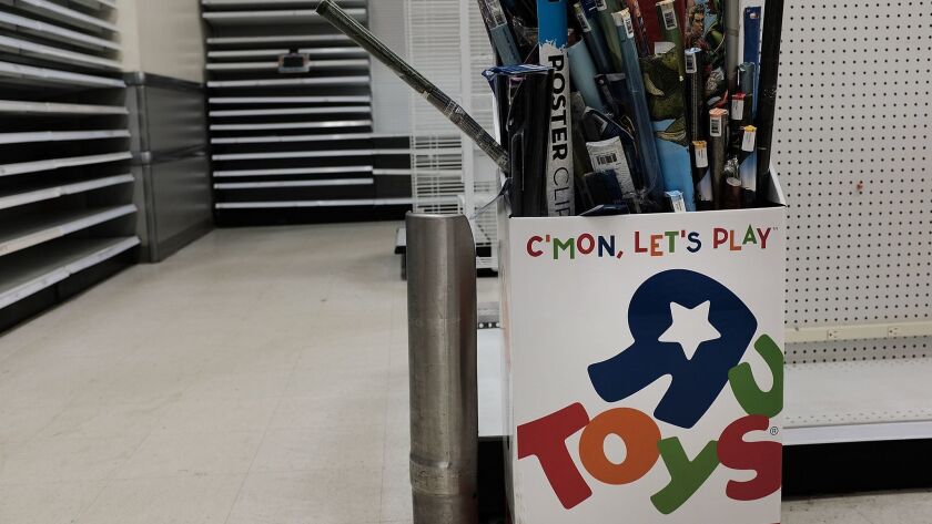Discounted merchandise is displayed at an emptying Toys R Us store in Brooklyn, N.Y.