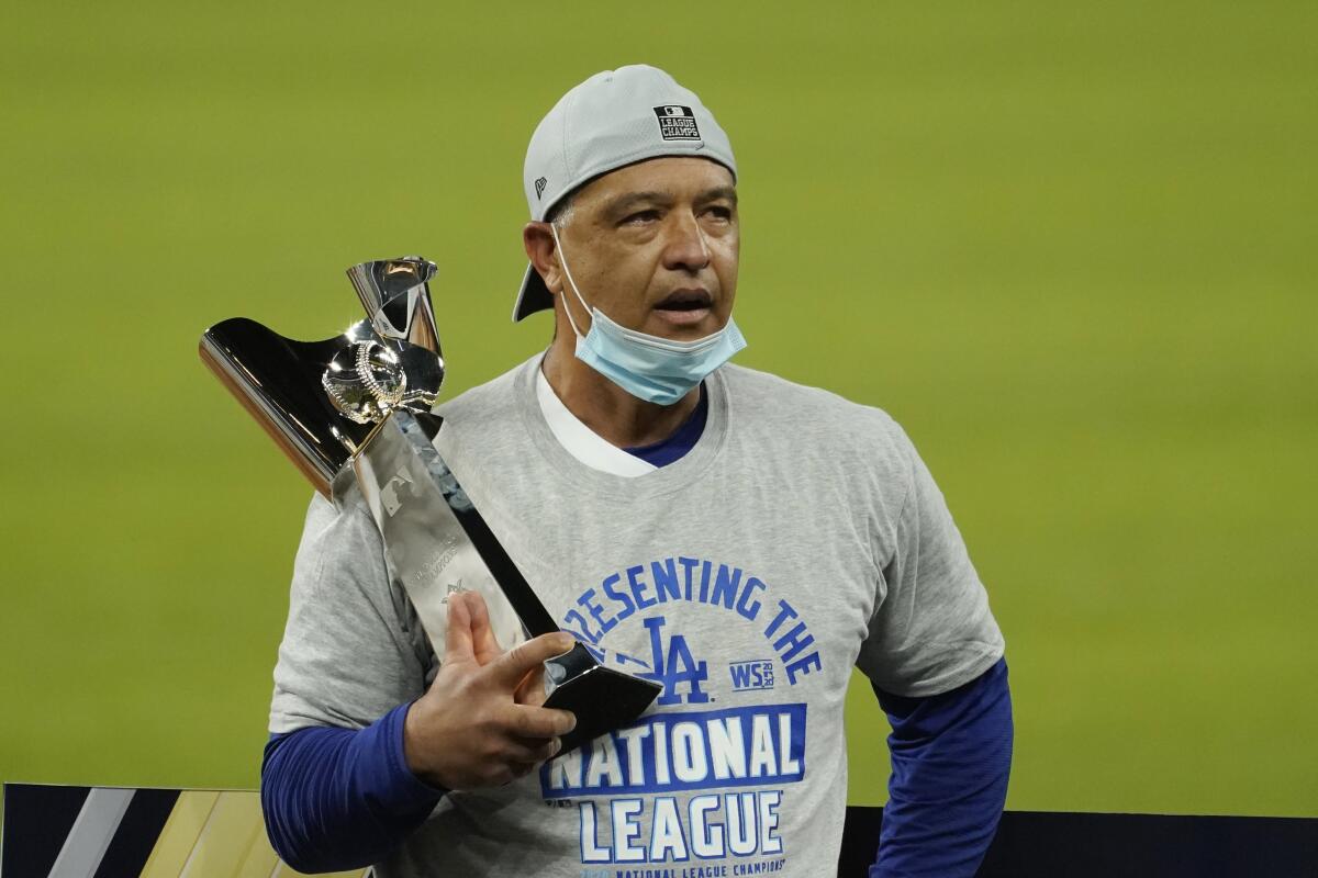 Dodgers manager Dave Roberts celebrates after winning the National League Championship Series title.