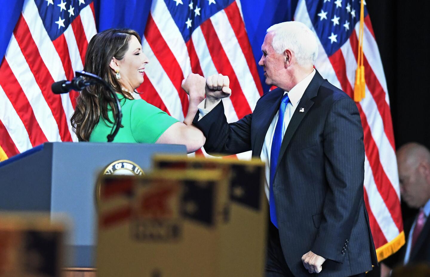 Party Chairwoman Ronna McDaniel greets Vice President Mike Pence.