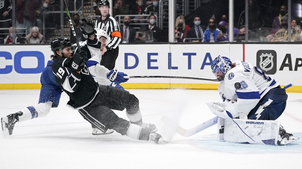 Kings left wing Alex Iafallo slides into Tampa Bay Lightning goaltender Andrei Vasilevskiy as he tries to score..