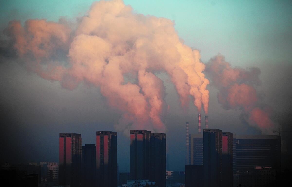 A thermal power plant discharges heavy smog into the air in Changchun, in northeast China's Jilin province, on Jan. 22, 2013.