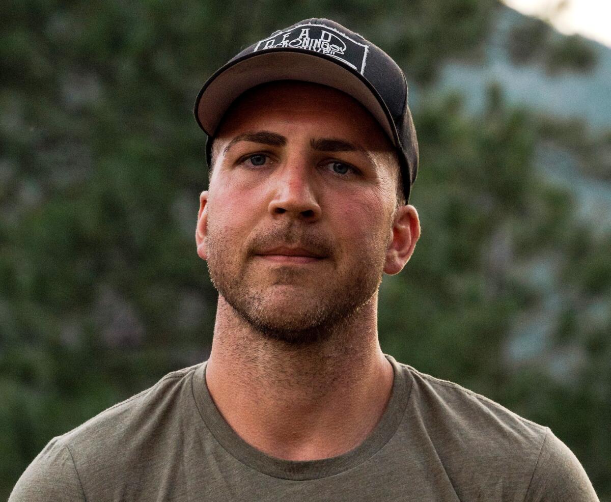 Tom Schueman in a T-shirt and baseball cap