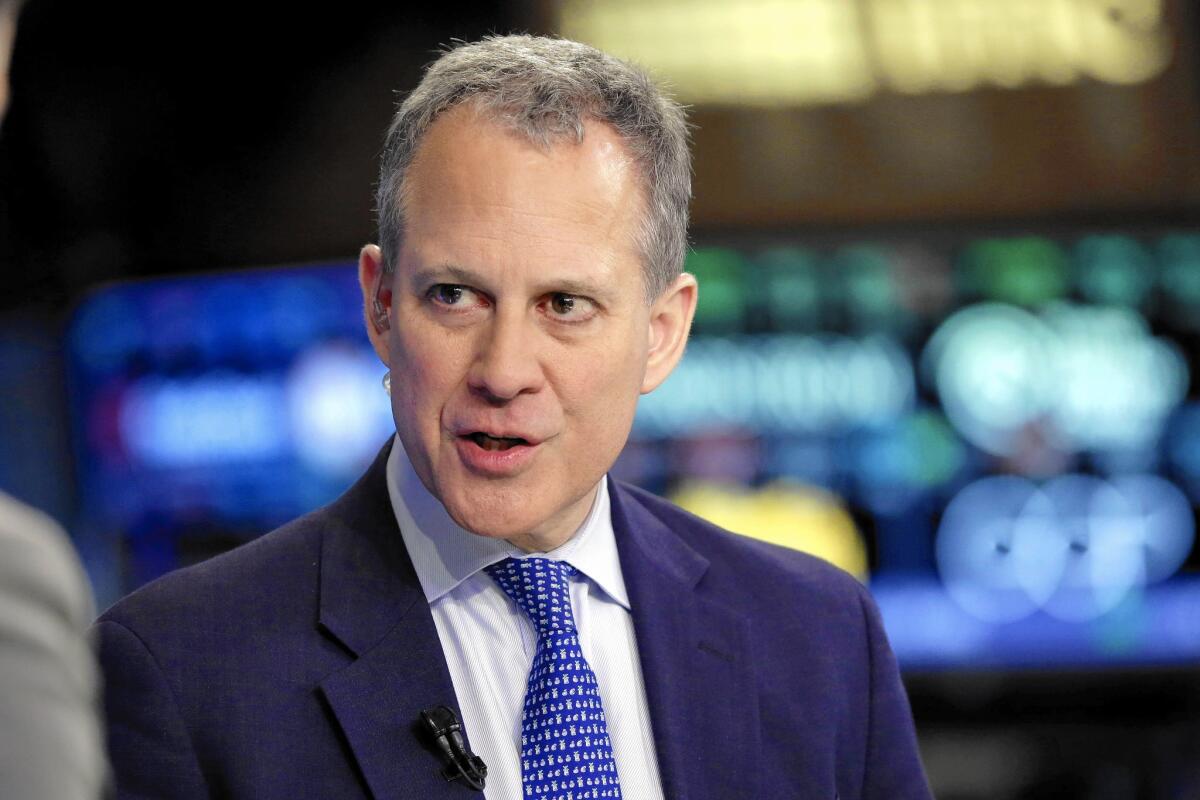 “Credit reports touch every part of our lives,” said New York Atty. Gen. Eric Schneiderman, shown above at the New York Stock Exchange last year. “The nation’s largest reporting agencies have a responsibility to investigate and correct errors on consumers’ credit reports.”