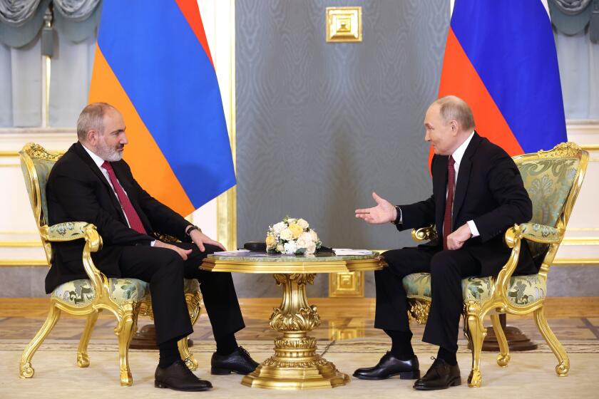 Russian President Vladimir Putin, right, gestures while speaking to Armenian Prime Minister Nikol Pashinyan on the sidelines of a meeting of the Eurasian Economic Union at the Kremlin in Moscow, Russia, on Wednesday, May 8, 2024. Russian President Vladimir Putin hailed the economic alliance's performance, saying that it helped boost the members' economic potential. (Alexander Shcherbak, Sputnik, Kremlin Pool Photo via AP)